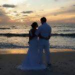 Beautiful couple on beach at sunset